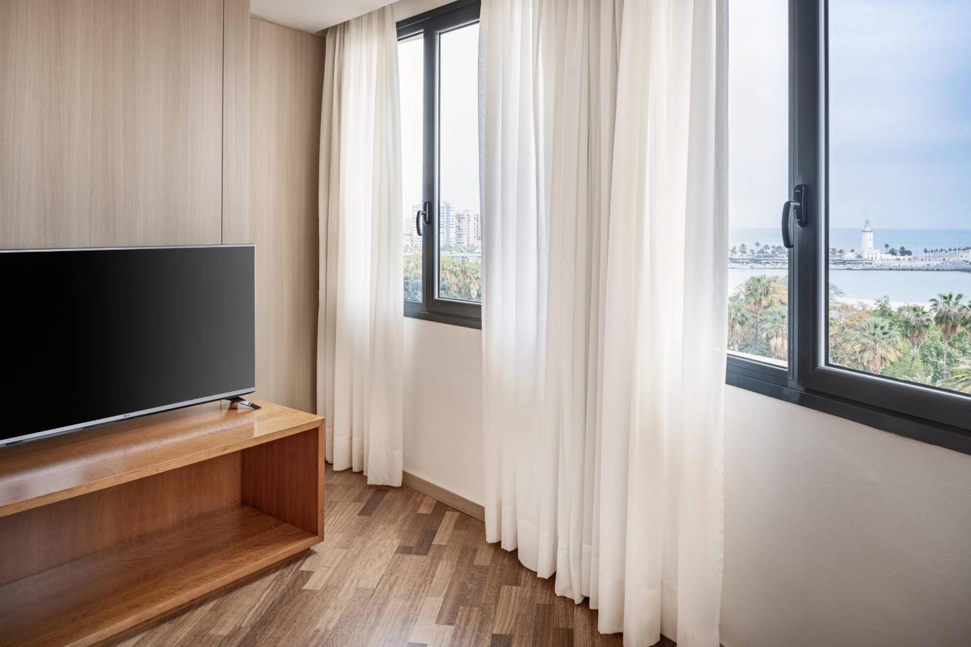 Habitación Familiar con cama extragrande y sofá cama